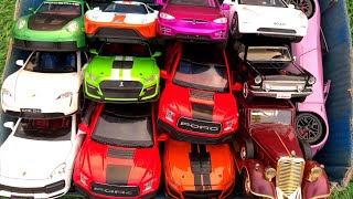 Box Full of Model Cars /Porsche 911, Ford GT, Tesla Roadster, Ford Mustang GT500, Coupe de Ville