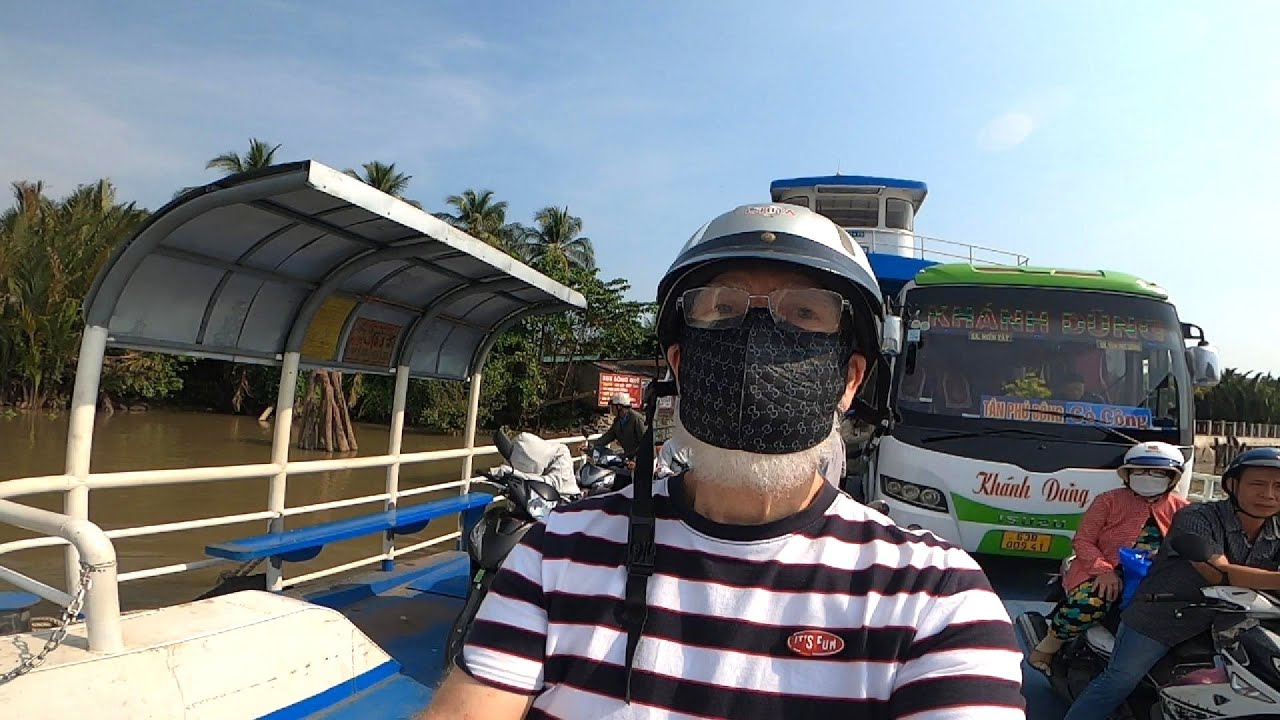 Crossing the massive Mekong River (Binh Ninh, Tien Giang province, Vietnam)