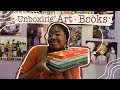 Unboxing a package full of art books  and a special announcement