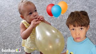 TODDLER BLOWING UP BALLOONS?! 