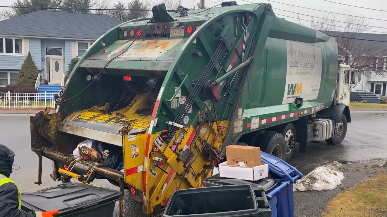 WM McNeilus Rearloader on Soaking Wet Manual Trash