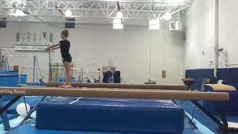 Back Handspring layout stepout on high beam.