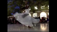 An Afro-Brazilian danceuse performs on Pacific Avenue.