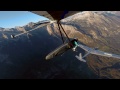 Hang Glider Touches Down on Sail Plane