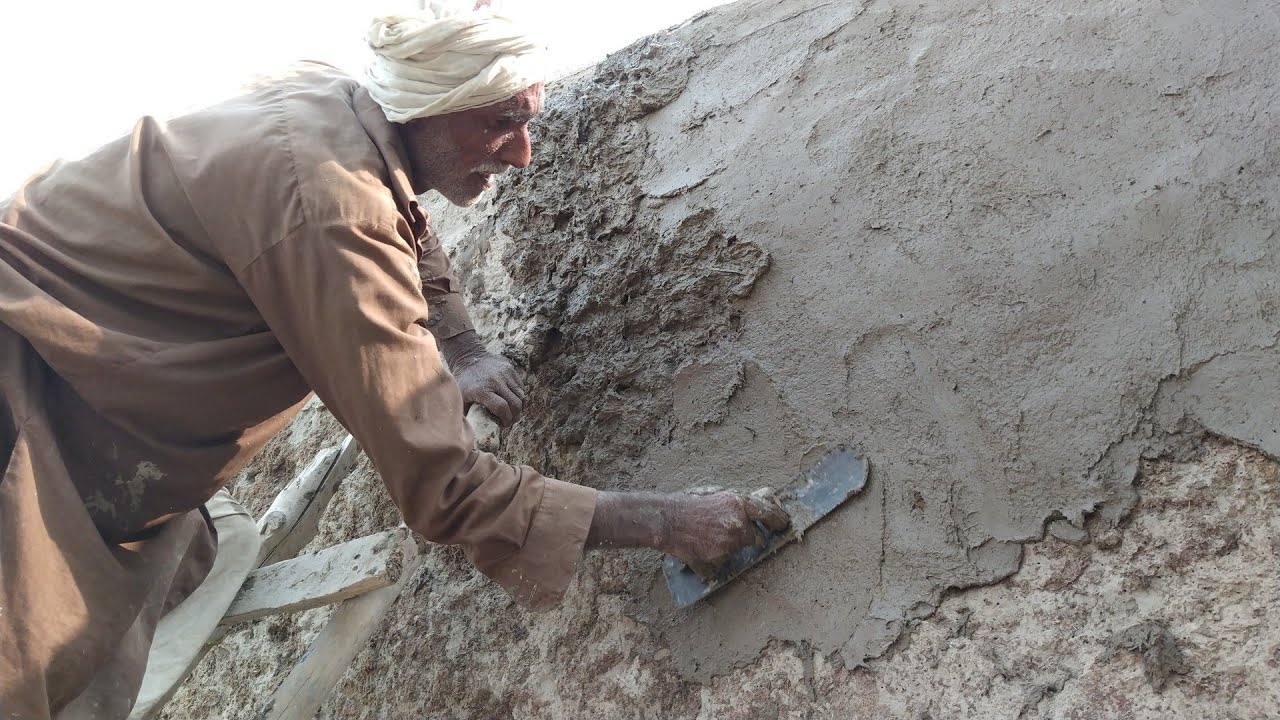 mud plaster on the wall village Punjab 4k   مٹی گارا دیوار