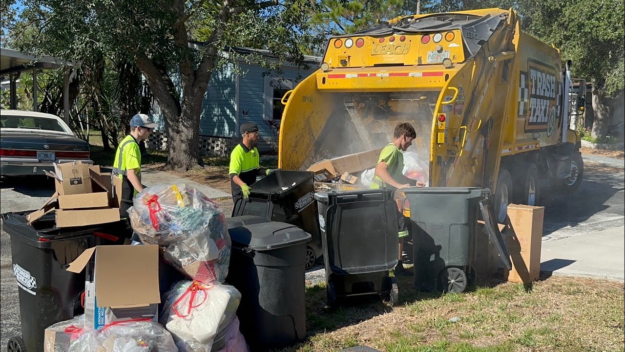 Trash Taxi Freightliner Leach Rear Loader Garbage Truck Packing a Massive Post Christmas Trash Pile