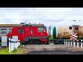 RailWay. Three Russian trains: 2 freight and one passenger/ Три поезда следуют через жд переезд