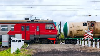 RailWay. Three Russian trains: 2 freight and one passenger/ Три поезда следуют через жд переезд