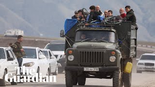 'I'll never return': thousands flee Nagorno-Karabakh after Azerbaijan gains control