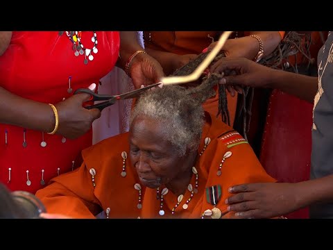 Mama Ngina Kenyatta shaves off Mau Mau veteran Field marshal Mary Muthoni Kirima, dread locks