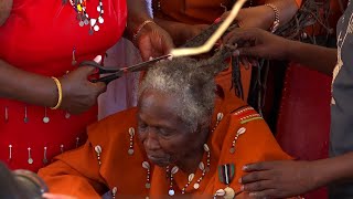 Mama Ngina Kenyatta shaves off Mau Mau veteran Field marshal Mary Muthoni Kirima, dread locks