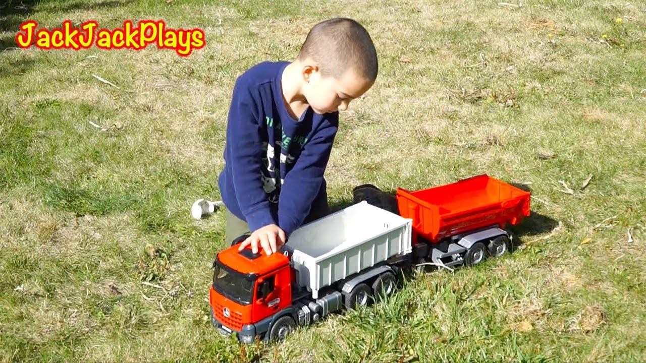 kids playing with toy trucks