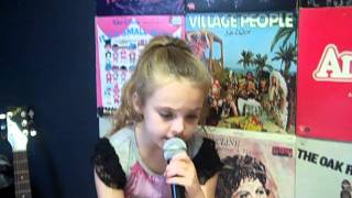 Anna Faith Howell practices "There is a God" at voice lessons.