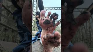 Barefoot In Muddy Bridge Drain