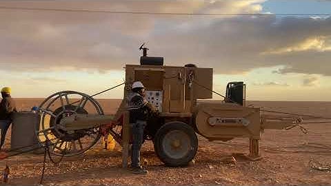 Conductor paying out 380 kV transmission line, Italian machine puller , best video
