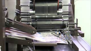 Stuffed Newspapers on Conveyor