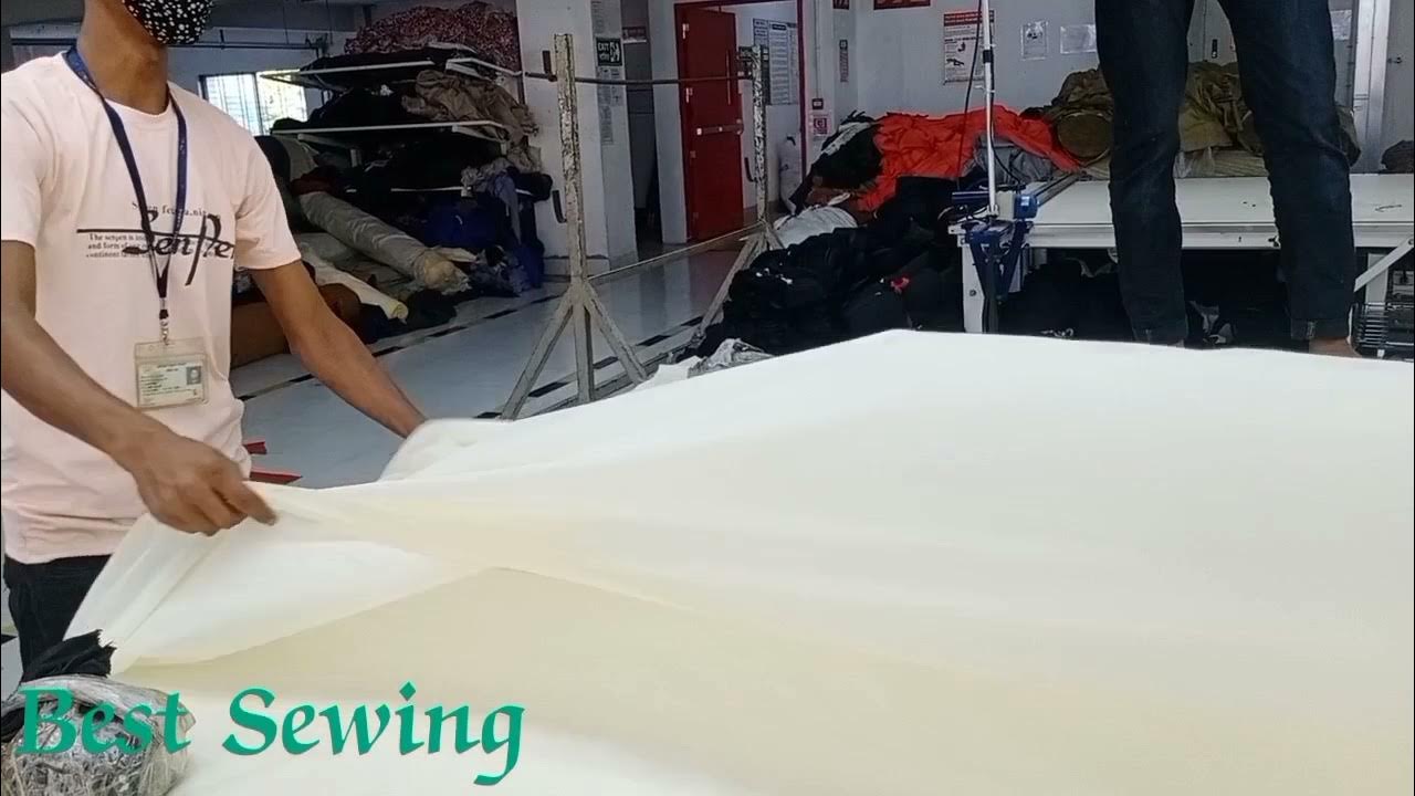 Manual Fabric Spreading/ Laying for Garments Cutting. ( Manual