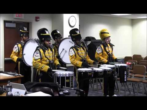 Members of NBHS Drumline perform for Cheney family