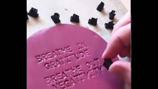 Stamping letters on Polymer clay