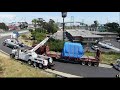 Trailer with 60,000lb machine load almost tips over on freeway