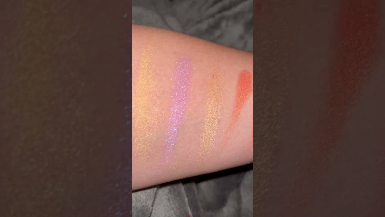 Swatches of the Makeup Revolution x Coca Cola Palette