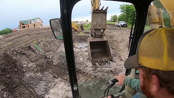 Cat 963B and 320C Starting A Sewer Lagoon