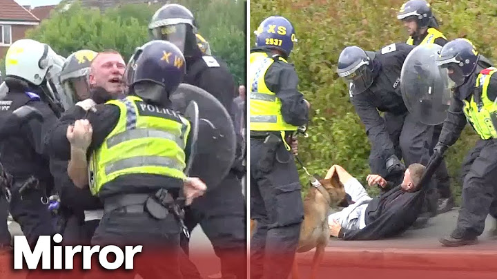 Police clash with furious protestors outside hotel housing asylum seekers