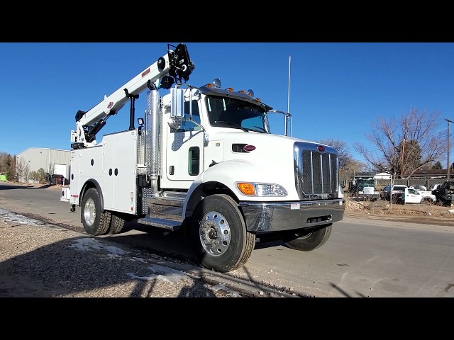 I heared these kind of trucks are calling 'caminhao arqueado'. can anybody  tell me whats the reason of this custom? and what is that big signs under  the hauler? or I'll thank