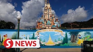 The rides are back in motion at hong kong disneyland as it gets ready
for its grand reopening on thursday (june 18) with face masks,
temperature checks and o...