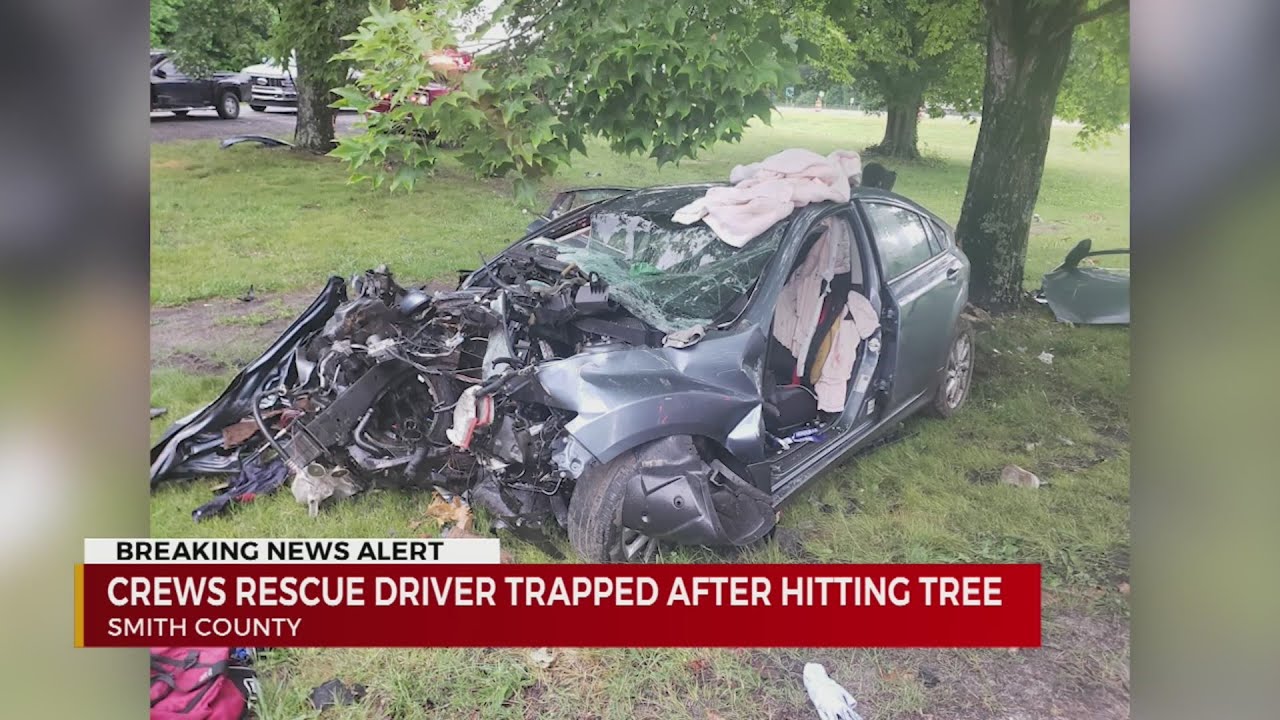 Crews rescue driver trapped after hitting tree in Smith County - YouTube