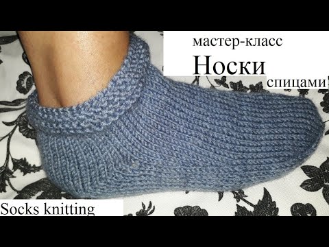 Sock with spoked boomerang heel.Sock. detailed. knitting needles