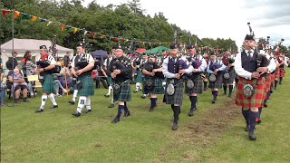 Massed Pipe Bands Afternoon March During 2023 Stonehaven Highland Games In Scotland