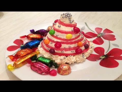 فيديو: كيفية صنع شجرة عيد الميلاد من الحلوى