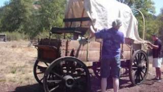 John Lovdokken and other Lane County teachers assemble a covered wagon at Dorris Ranch as part of a Teaching American 