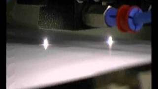High speed paper/plastic perforation using carbon dioxide lasers