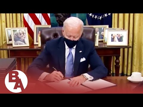 Which executive orders did Biden sign on his first day?
