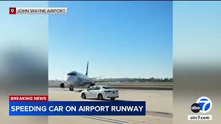 Car speeds past several planes on taxiway at California airport, video shows