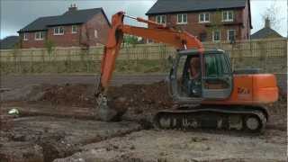 Hitachi excavator digging foundation