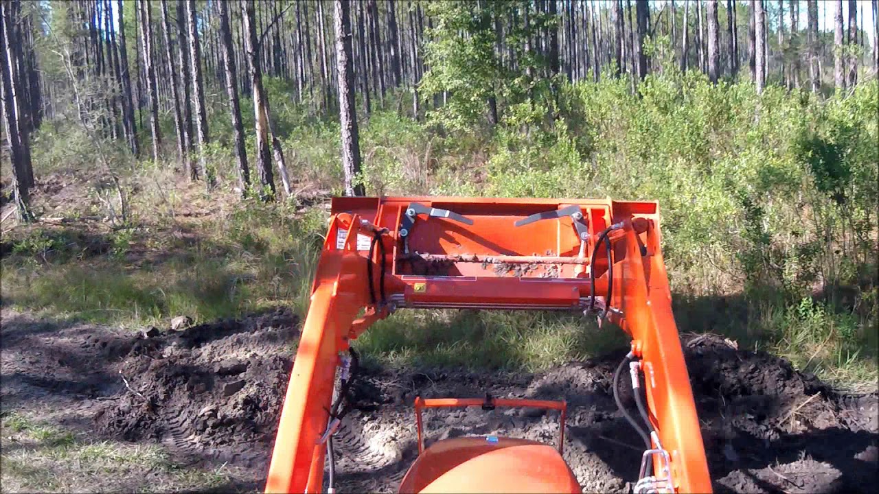 4x speed Kubota L2501 Digging and grading road to camp YouTube