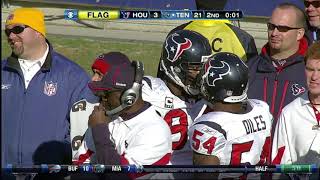 Antonio Smith and Brian Cushing fight each other in the middle of a game