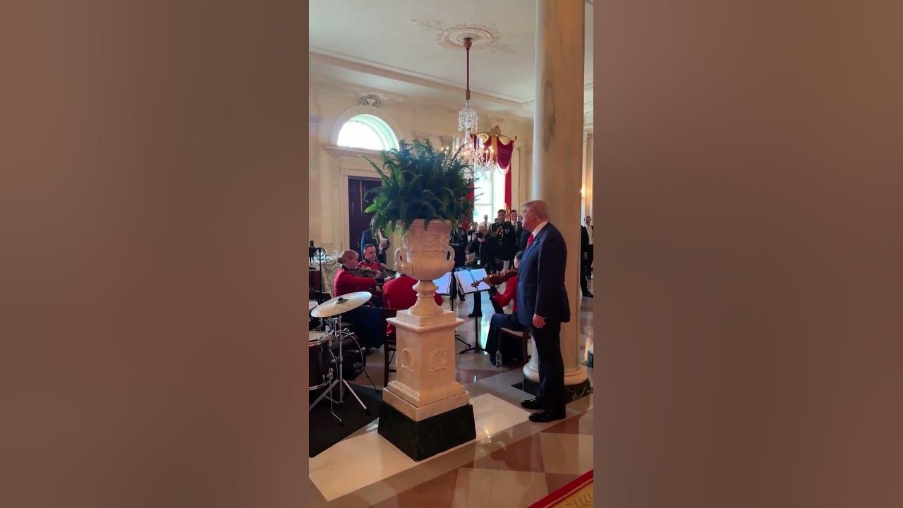 Trump conducts United States Marine Band as they play God Bless America
