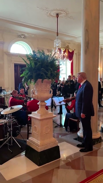 Trump conducts United States Marine Band as they play God Bless America