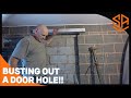 PUNCHING A HOLE FROM GARAGE TO HOUSE FOR A DOOR !
