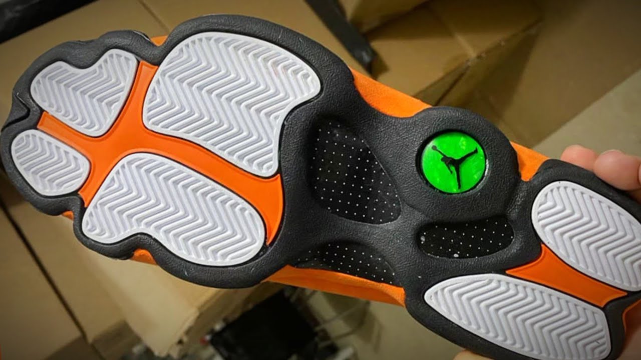 black and orange jordan 13