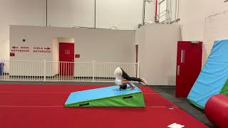 Forward roll down incline to feet - use hands