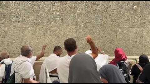 Muslim pilgrims cast first stones at pillar of Satan during Hajj