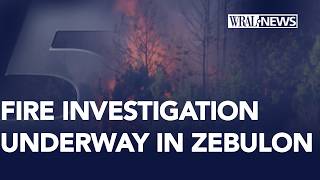 Fire crews work to control a large fire near Zebulon