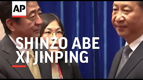 Japan's Prime Minister Shinzo Abe and Chinese President Xi Jinping hold a frosty handshake at APEC s - DayDayNews