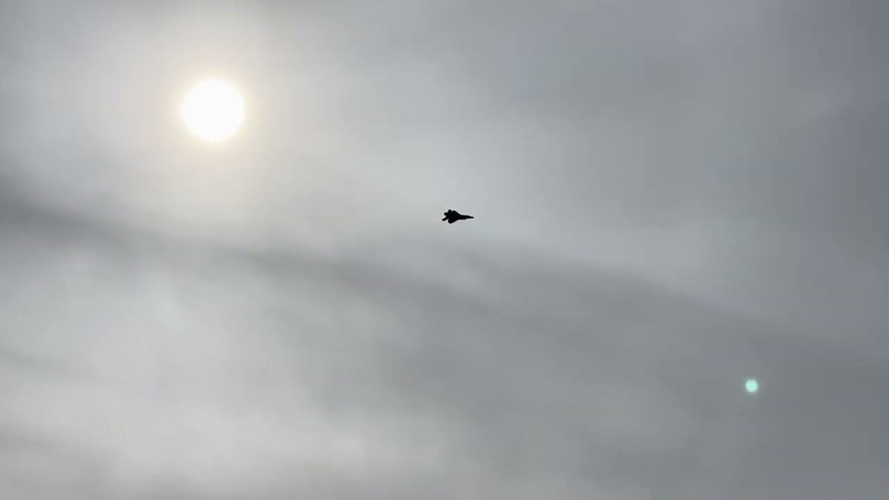 F22 Steath Raptor flying overhead with landing gear down