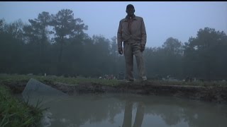 Graves filled with flood water; burial vaults remain unearthed